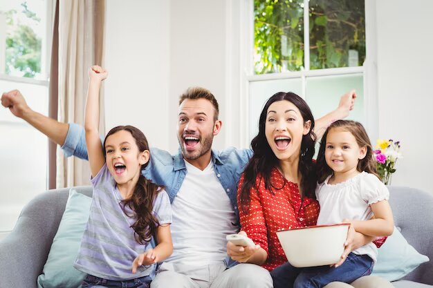 family-cheering-while-watching-tv-home_107420-21181